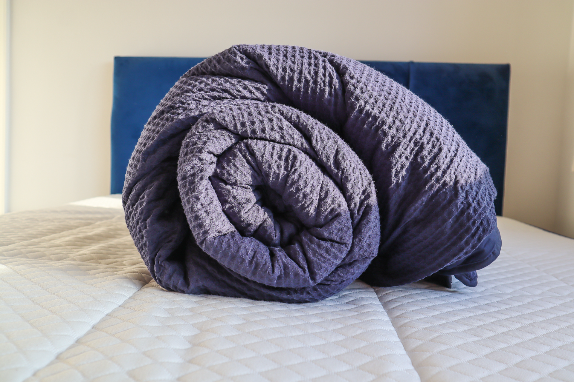 the fine bedding company night lark natural cotton waffle duvet on bed