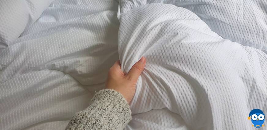 Holding DreamCloud duvet