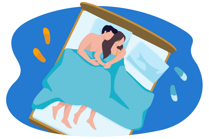Couple snuggling in bed