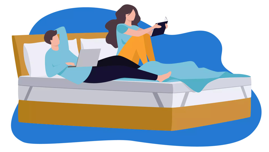 couple sat on mattress topper